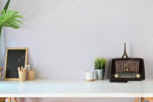 Loft workspace with vintage radio, mockup poster and copy space