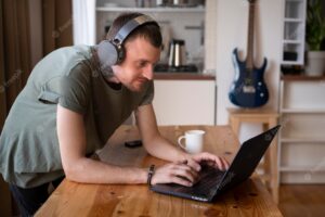 Man listening some music on headphone in his free time