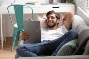 Man watching streaming service on his tablet