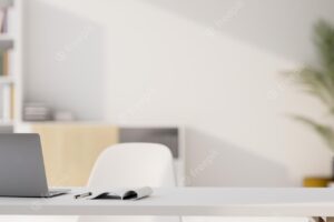 Modern minimal white office room white desk workspace with notebook laptop and copy space