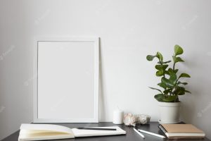 Modern workspace: open sketchbook with white blank pages