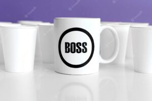 Mug with boss text on table