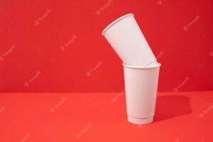 Paper cups with red background