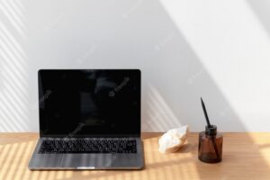 Personal laptop on the wooden desk