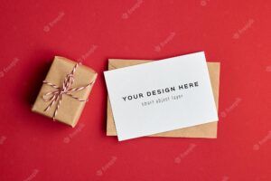 Valentines day card mockup with gift box on red paper background