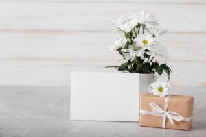 White flowers arrangement with empty card