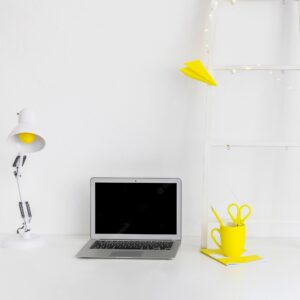White modern workplace with yellow details and ladder