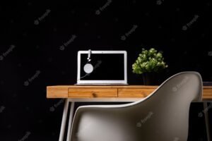 Wood desk with chair and laptop