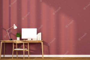 Workplace and red wall in apartment or home.