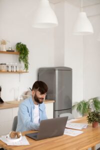 Young man working on his laptop at work