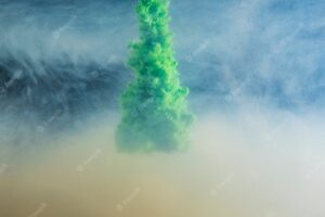 Abstract dense green cloud between light haze