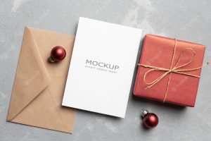 Blank greeting card mockup with envelope and christmas gift box