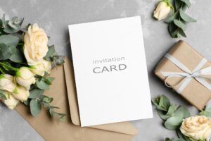 Blank greeting card mockup with gift envelope and roses flowers