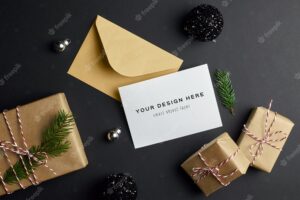 Christmas greeting card mockup with fir tree branch, gift boxes and festive decorations