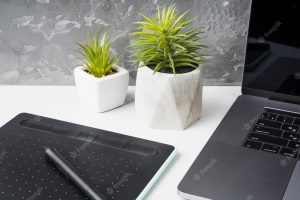 Close up of devices and decor plants