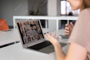 Close up employees in online meeting