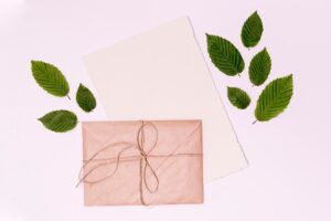 Close-up top view tied envelope and leaves