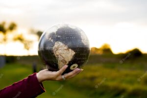 Closeup shot of a female holding a globe