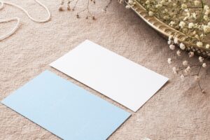 Composition of papers on beige tablecloth