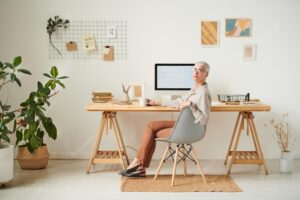 Confident lady sitting at desk