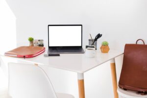 Desk arrangement with laptop and chair