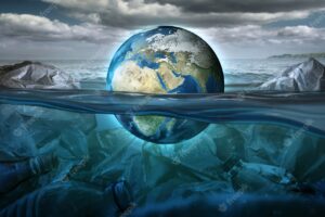 The earth floats in the sea full of garbage and pollution. environment concept. earth image provided by nasa