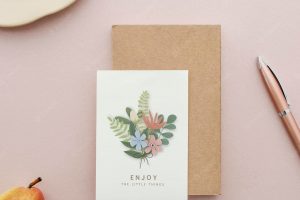 Floral postcard mockup on a pink surface