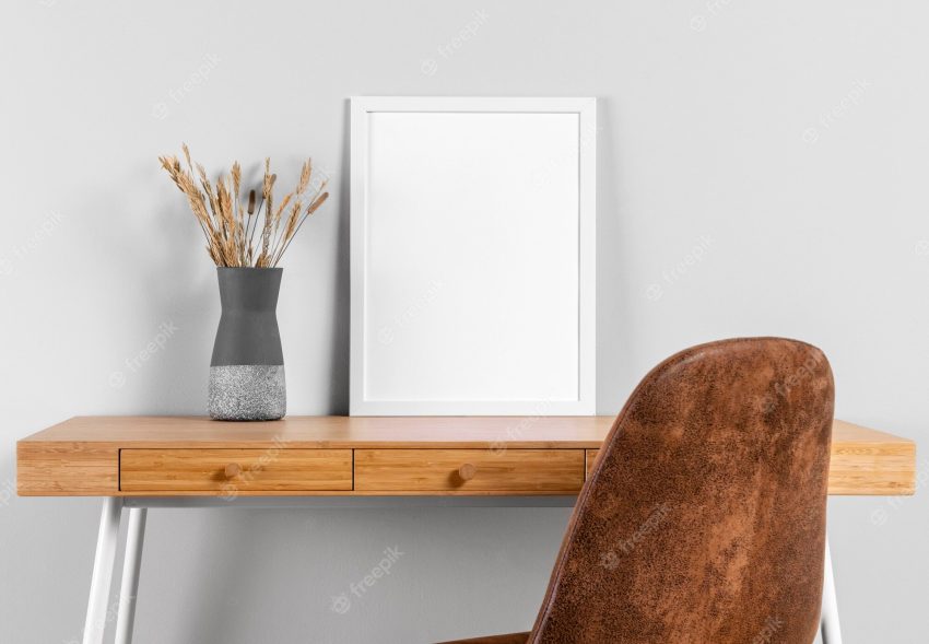 Frame mock up on table beside vase