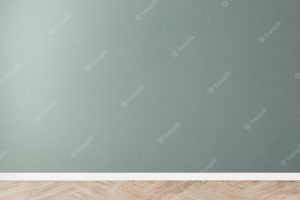 Green blank concrete wall mockup with a wooden floor