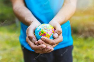 Hands carefully holding sphere
