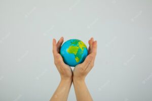Hands holding globe world population day