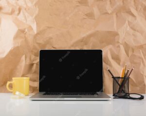 Laptop against brown paper texture