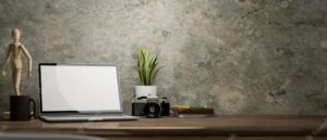Laptop computer mockup decor and copy space on wooden table over cement loft wall 3d render