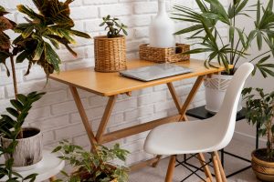 Laptop on table with plants