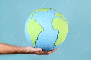 Paper style earth globe shape in hand
