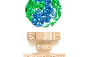 Save the earth words on cubes and planet symbol