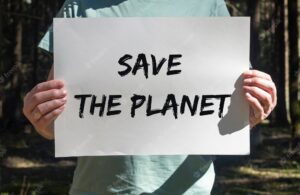 Save the planet text on placard in hands
