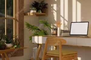 Side view of cozy minimal home office working room interior with laptop mockup on wood table