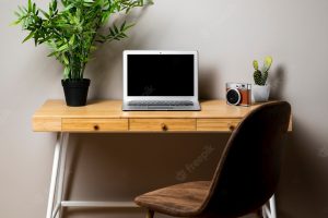 Simple wood desk with chair and laptop