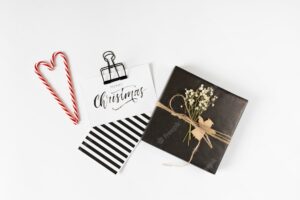 Small gift box with christmas inscription on paper