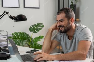 Smiley man enjoying working from home
