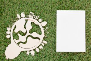 World environment day wooden object with empty card on grass