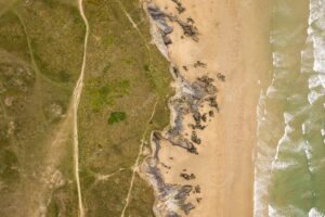 Aerial view of the shore of the ocean near newquay beach, cornwall