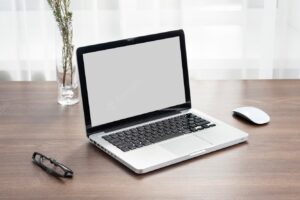Business desk arrangement with laptop
