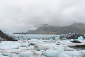 Cloudy nature landscape by lake