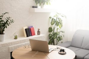 Design of workplace with laptop and cup in home office