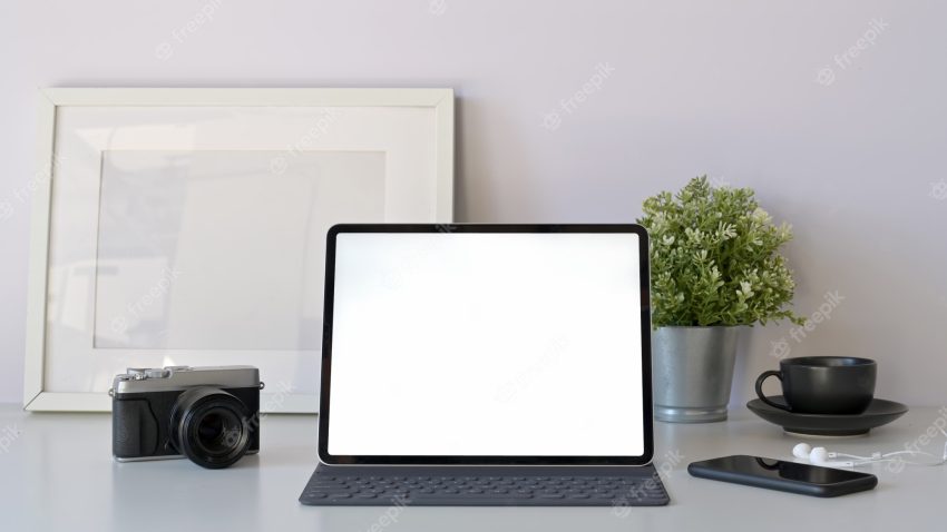 Home office mockup tablet with smart keyboard on minimal white workspace table.
