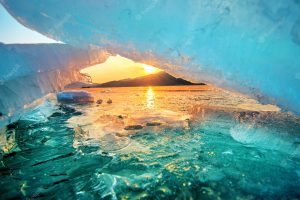 Very large and beautiful chunk of ice at sunrise in winter.