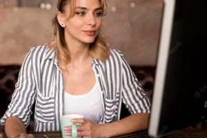 Woman working on computer from home