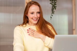 Young and beautiful woman having online meeting